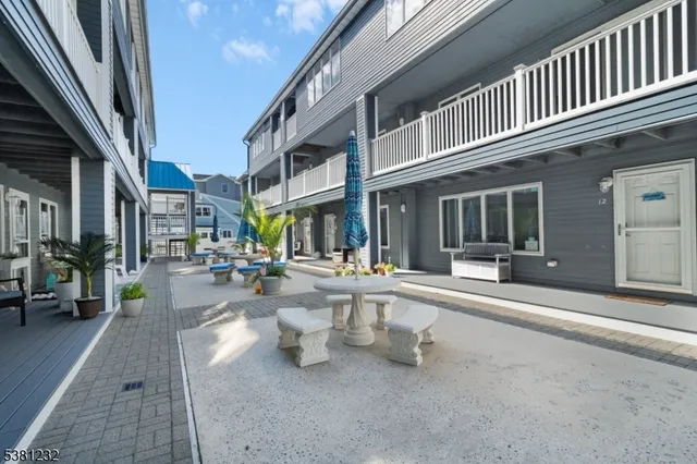 a view of a building with sitting area