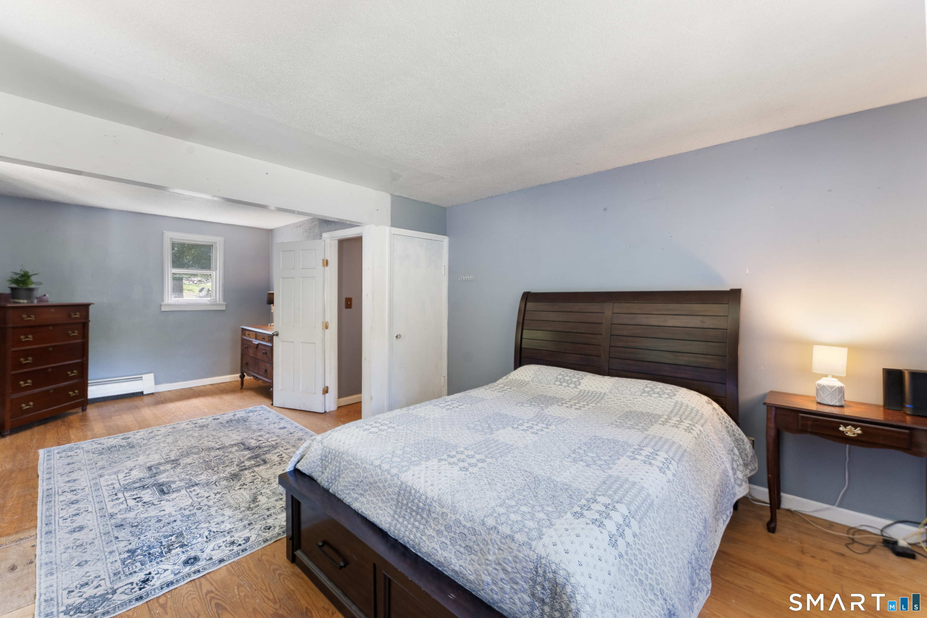 273 Hartford Road Brooklyn, CT 06234 - Photo 10 of 24 Generously sized first floor primary bedroom.