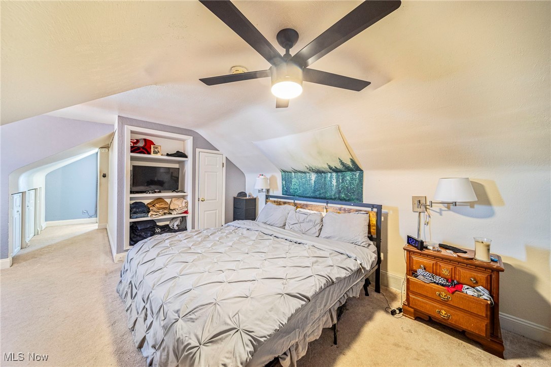 617 Pendley Road Willowick, OH 44095 - Photo 24 of 44 Carpeted bedroom with vaulted ceiling and ceiling fan