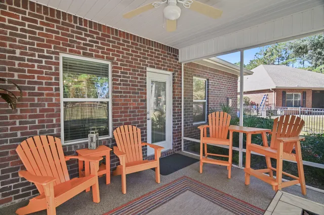 a view of a chairs and table in the patio