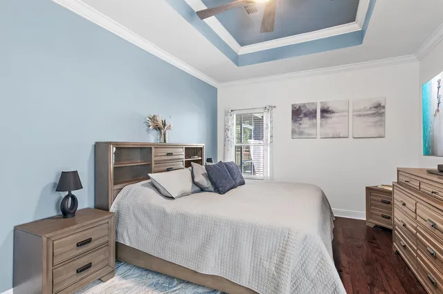 a bedroom with a bed and a dresser