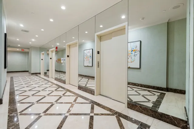 a very nice looking room with a large mirror