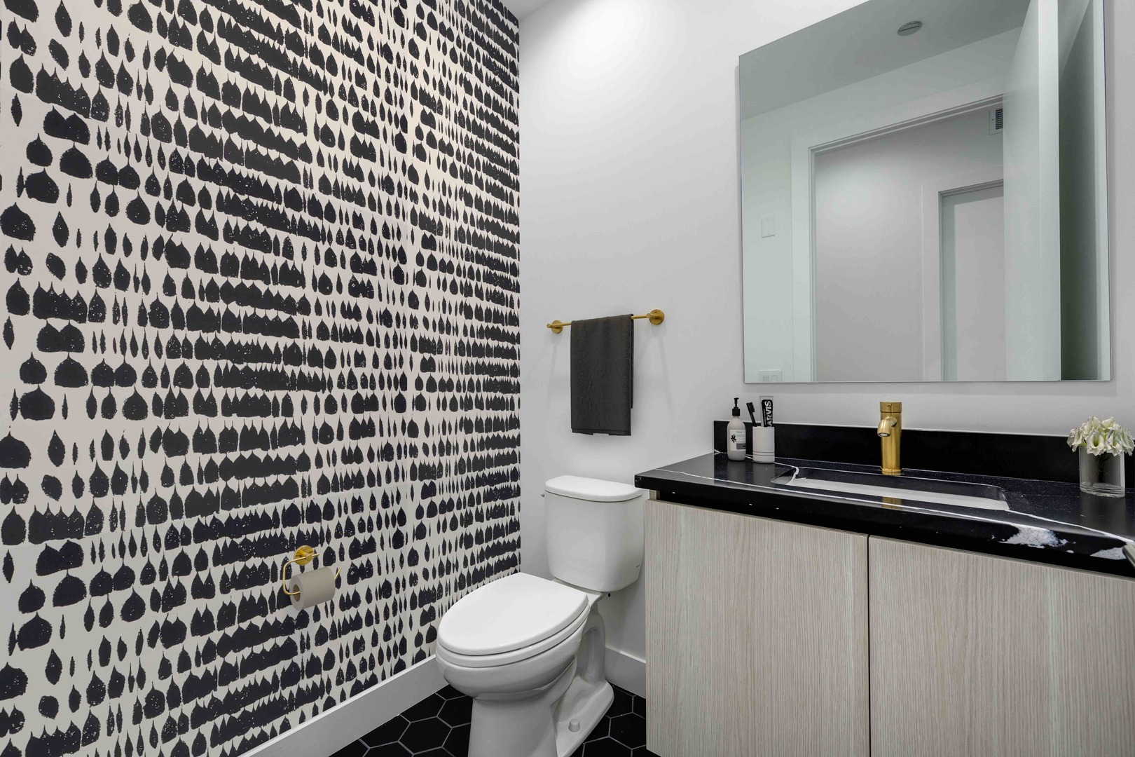 313 South Racine Avenue, Unit PHB Chicago, IL 60607 - Photo 14 of 30 a bathroom with a sink a toilet and a mirror