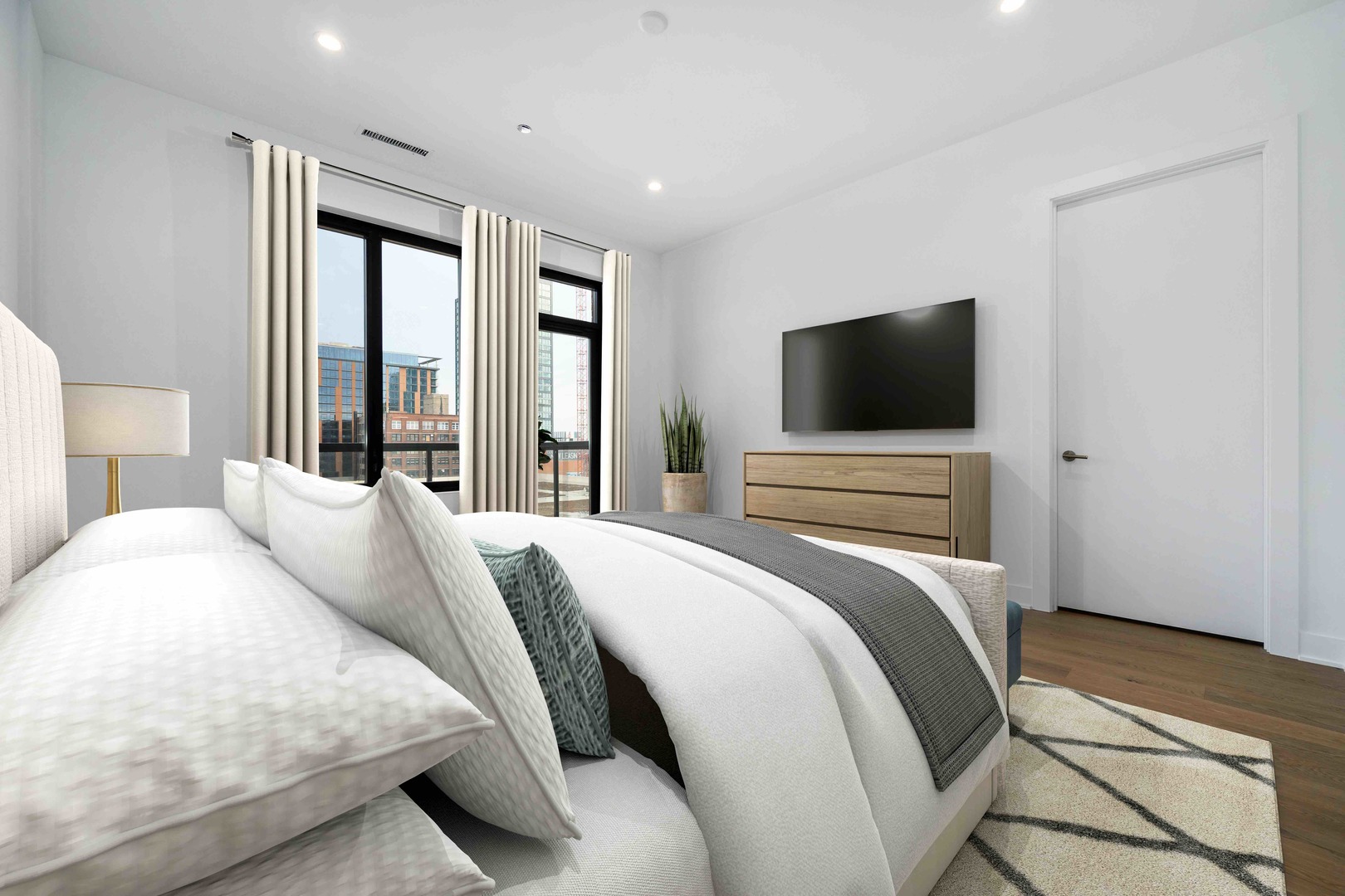 313 South Racine Avenue, Unit PHB Chicago, IL 60607 - Photo 18 of 30 a bedroom with a bed and a flat screen tv