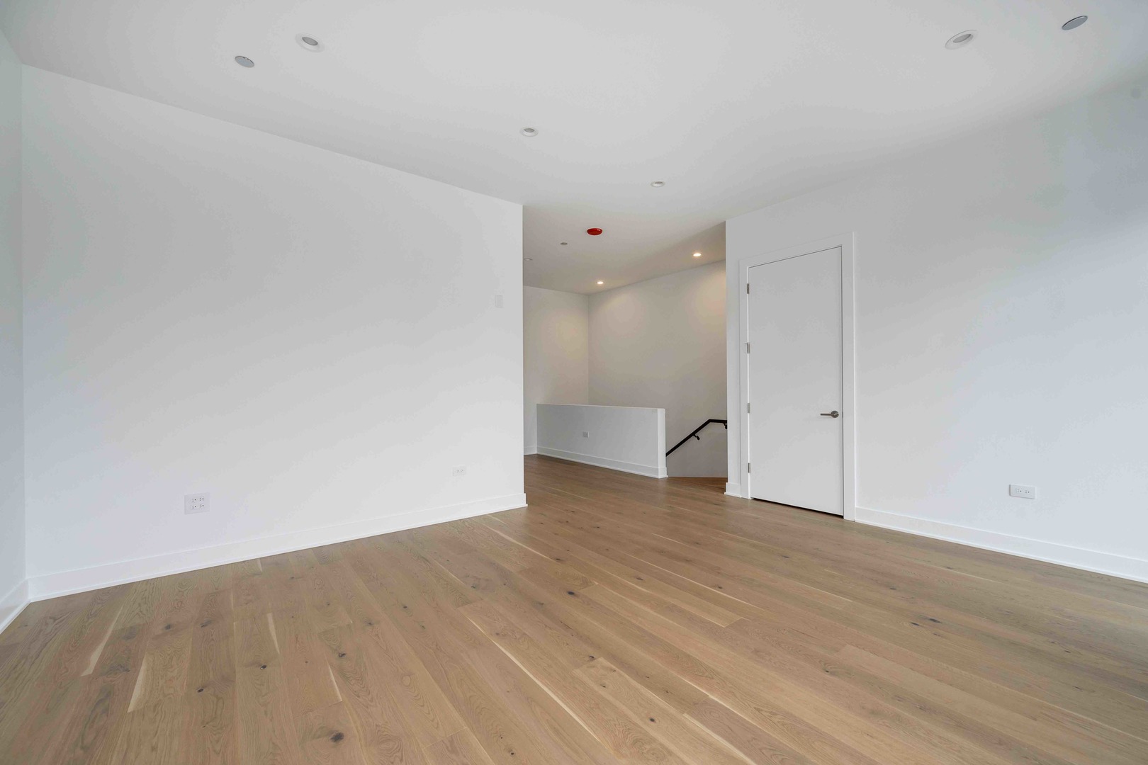 313 South Racine Avenue, Unit PHB Chicago, IL 60607 - Photo 24 of 30 a view of an empty room with wooden floor