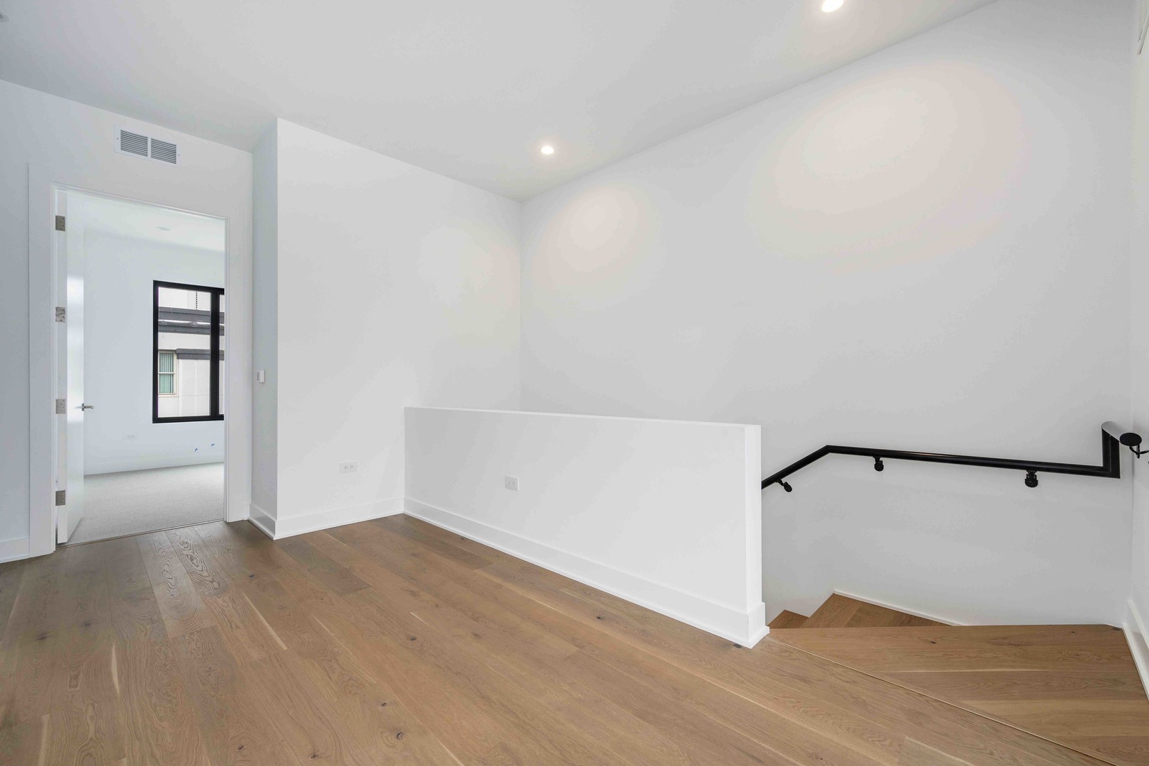 313 South Racine Avenue, Unit PHB Chicago, IL 60607 - Photo 25 of 30 a view of a room with wooden floor