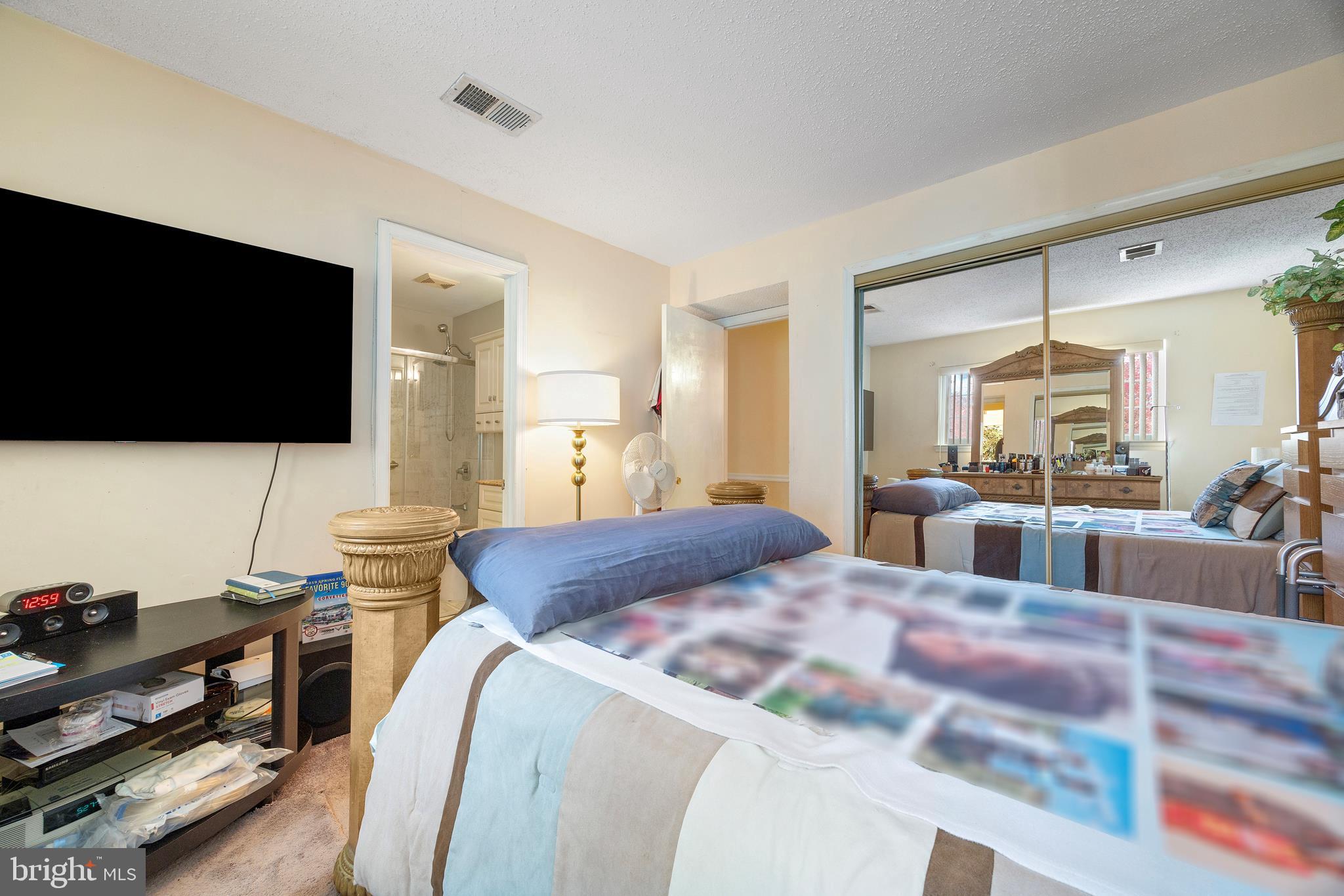 14106 William Street, Unit 19B Laurel, MD 20707 - Photo 19 of 31 a living room with furniture and a flat screen tv
