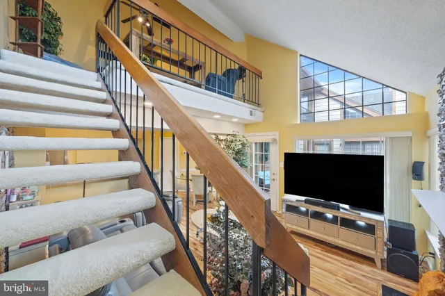 a stair with glass top table and chairs