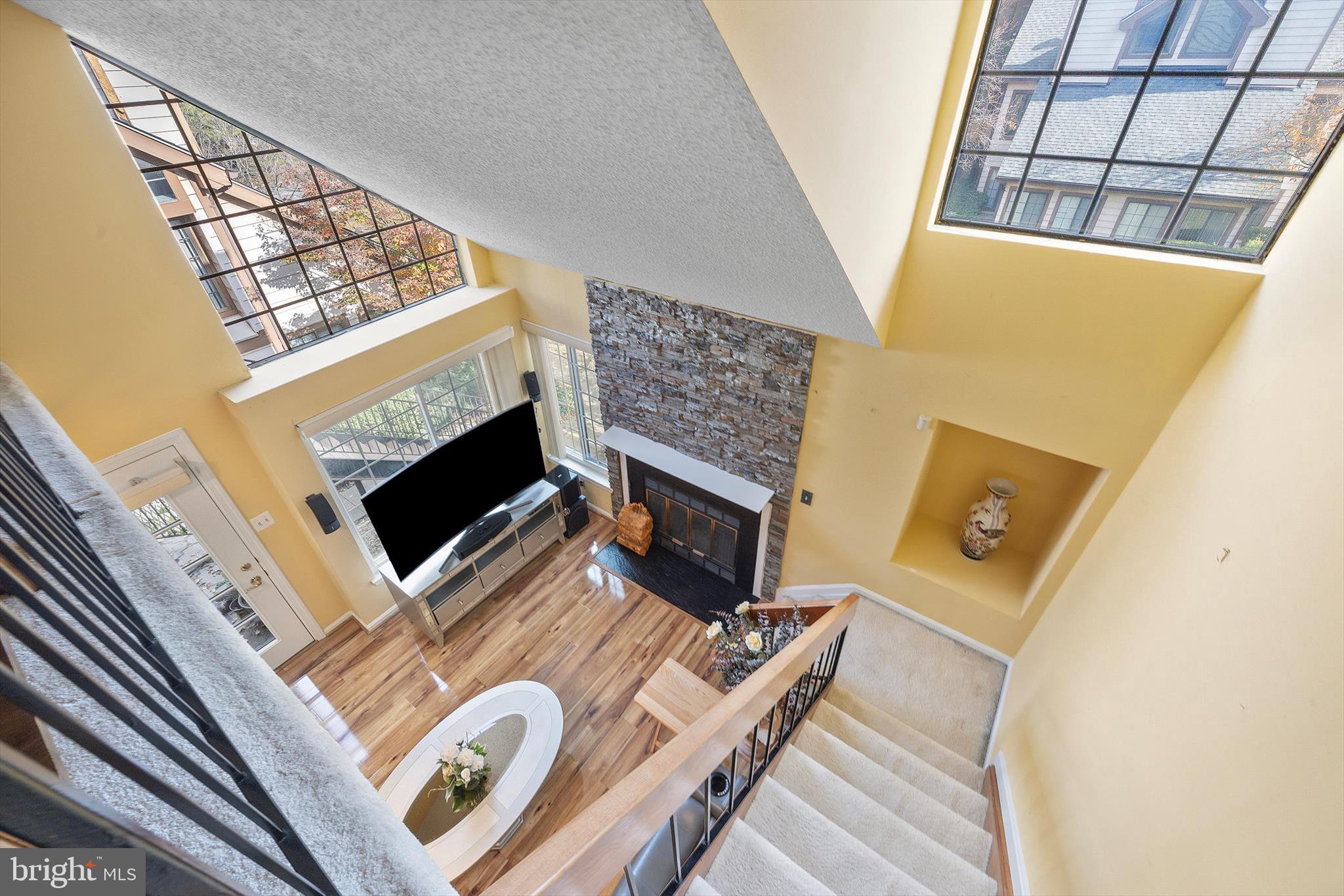 14106 William Street, Unit 19B Laurel, MD 20707 - Photo 26 of 31 a living room with furniture and a fireplace