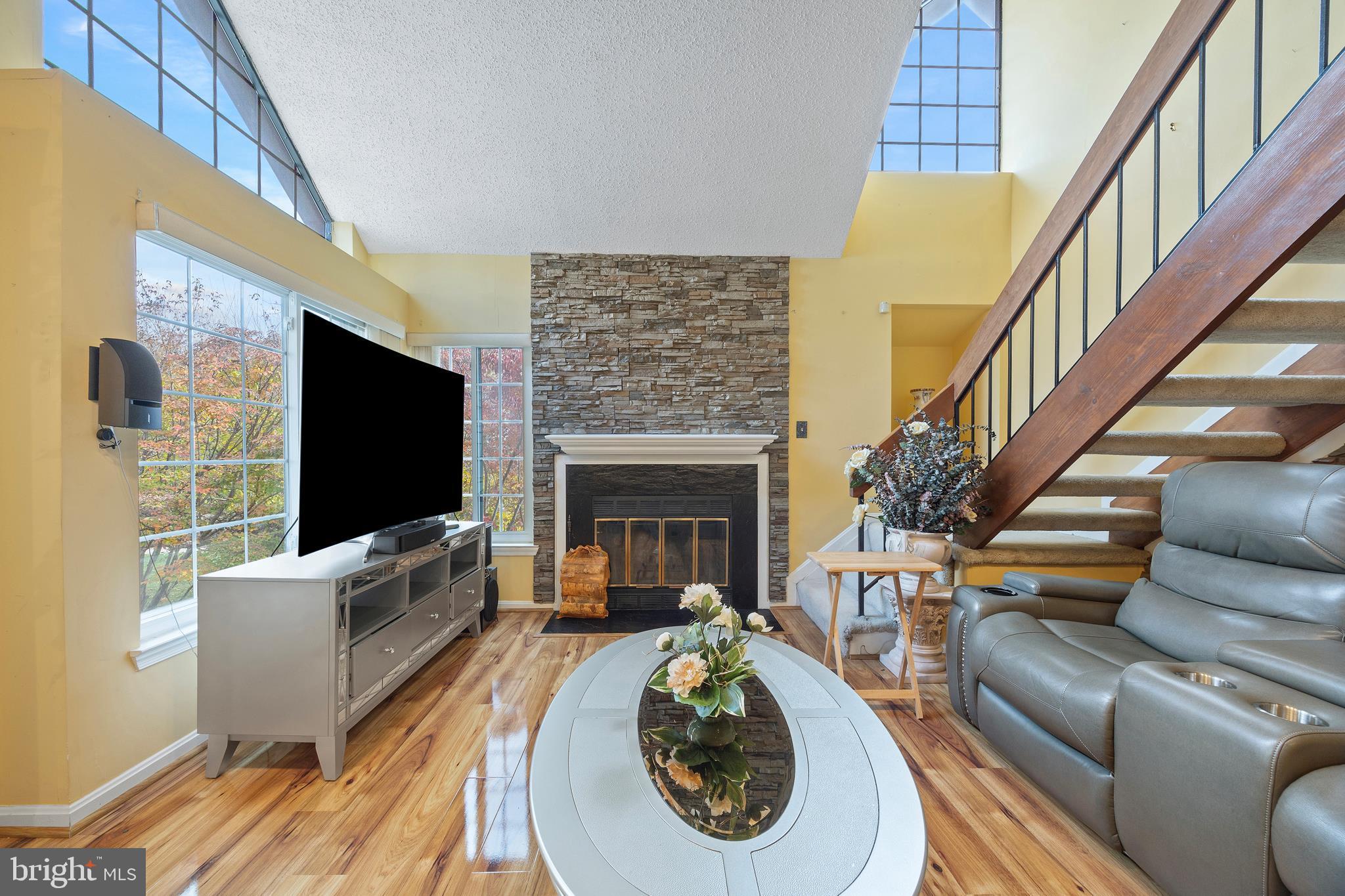 14106 William Street, Unit 19B Laurel, MD 20707 - Photo 5 of 31 a living room with furniture and a flat screen tv