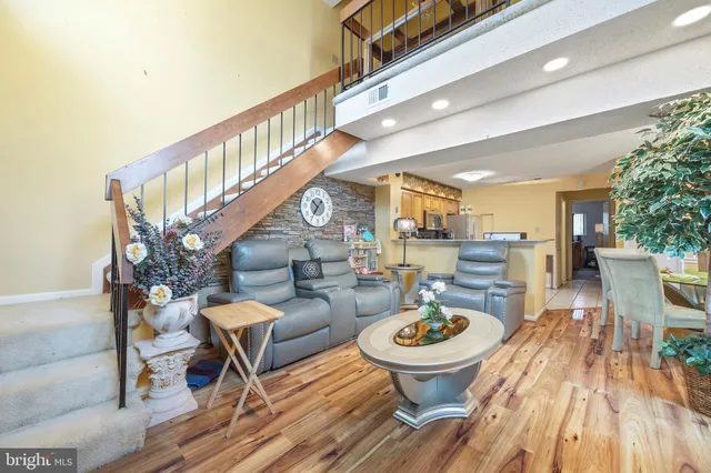 a living room with furniture and a table