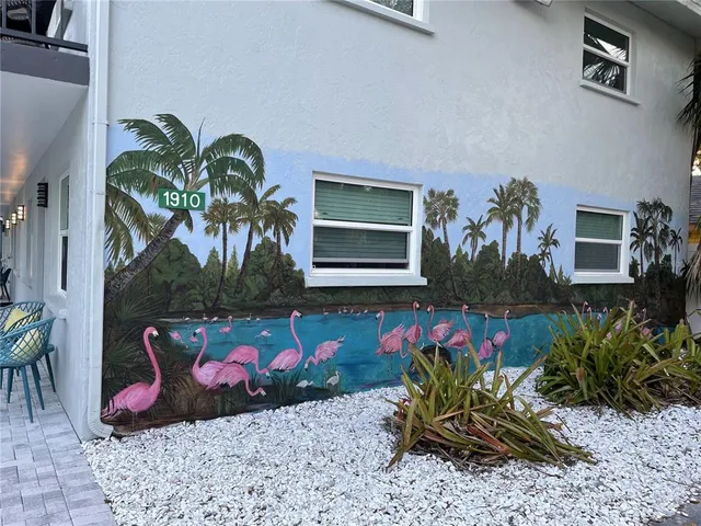 a potted plant sitting in front of a house