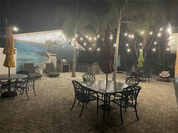 a view of a swimming pool with a patio