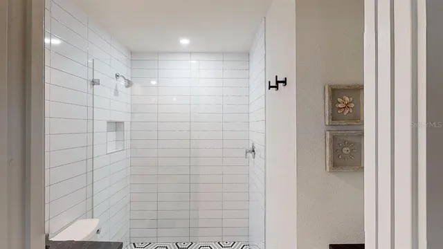 a bathroom with a bathtub and shower