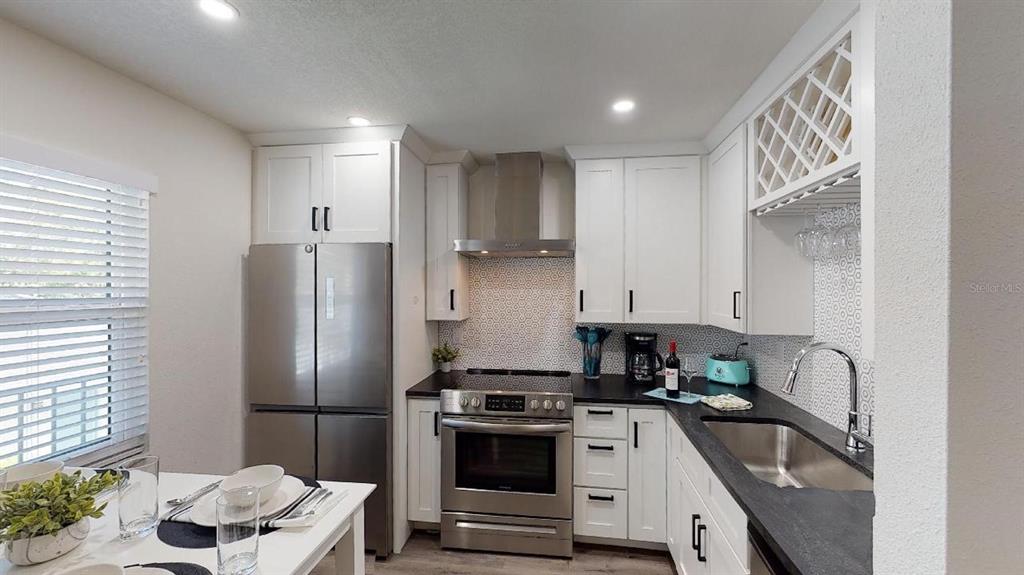 1910 Morrill Street Sarasota, FL 34236 - Photo 30 of 52 a kitchen with a refrigerator sink and stove