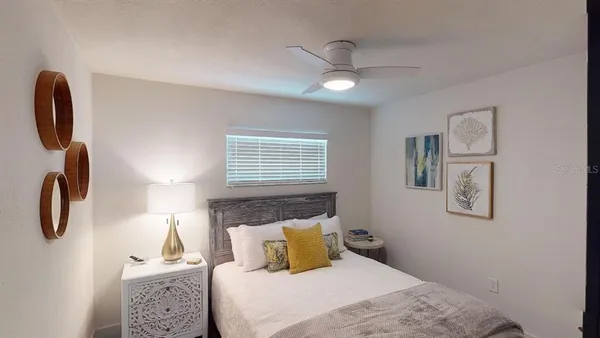a kitchen with granite countertop a sink stove and refrigerator