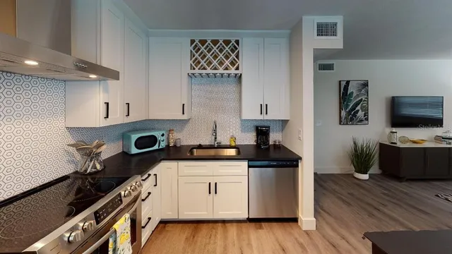 a bathroom with a sink toilet and mirror