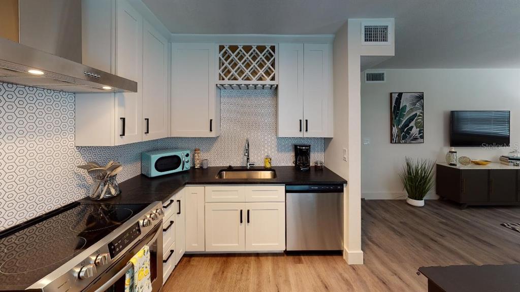 1910 Morrill Street Sarasota, FL 34236 - Photo 47 of 52 a kitchen with a stove and a wooden floor