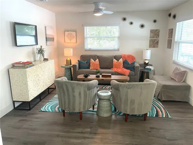 a living room with furniture and a window