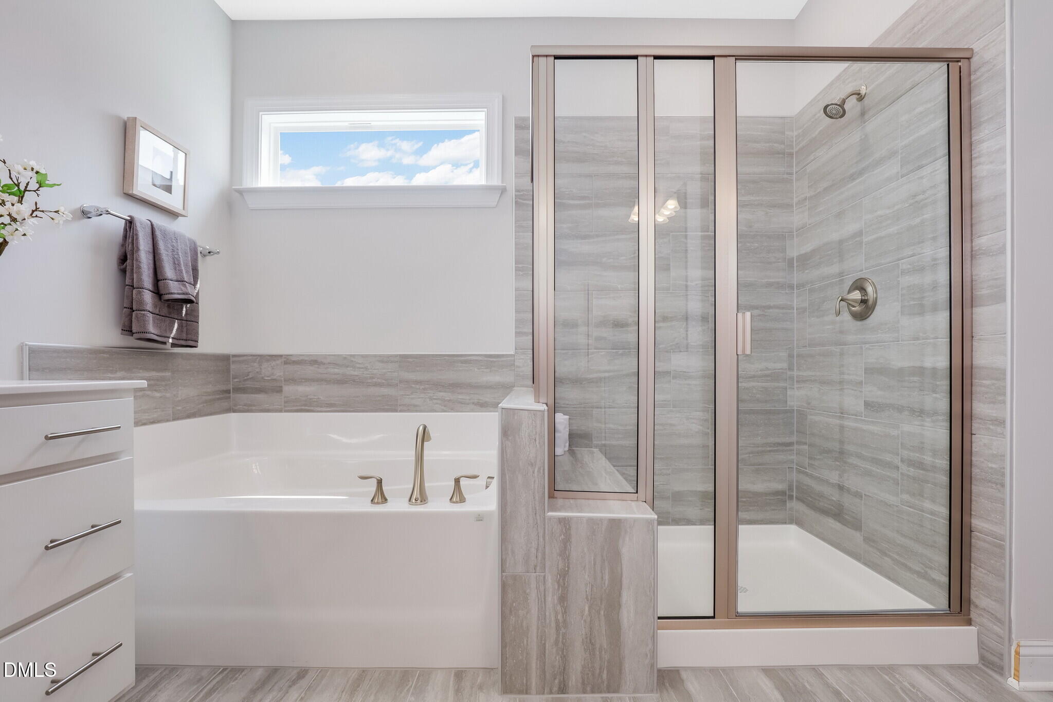 112 Fablewood Trail Garner, NC 27529 - Photo 29 of 39 a bathroom with a bathtub and a shower