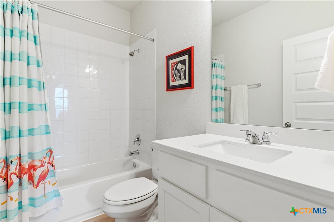 149 Cutleaf, Unit 31 San Marcos, TX 78666 - Photo 16 of 26 a bathroom with a sink a toilet and shower