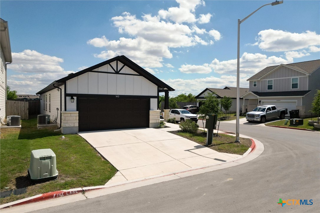 149 Cutleaf, Unit 31 San Marcos, TX 78666 - Photo 24 of 26 a front view of house with outdoor seating and barbeque oven