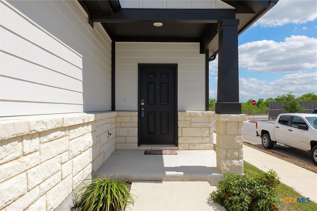 149 Cutleaf, Unit 31 San Marcos, TX 78666 - Photo 3 of 26 a front view of a house with a garden