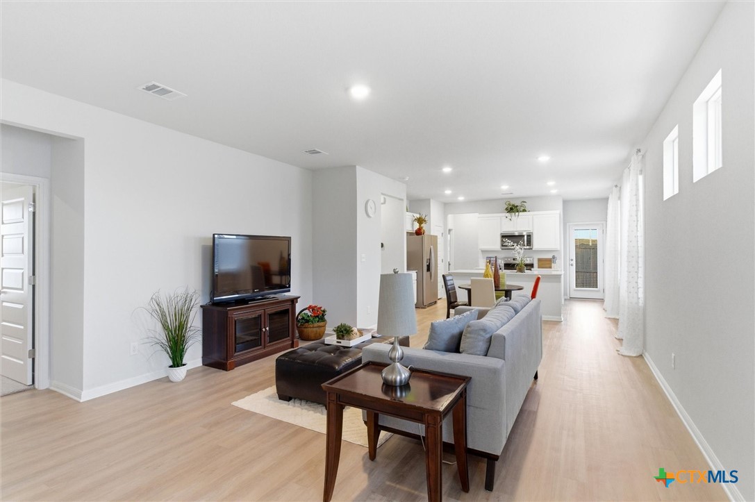 149 Cutleaf, Unit 31 San Marcos, TX 78666 - Photo 5 of 26 a living room with furniture and a flat screen tv