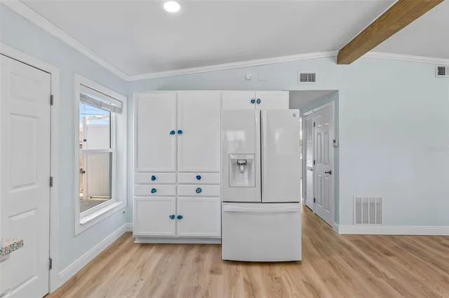 a view of an empty room and a bathroom