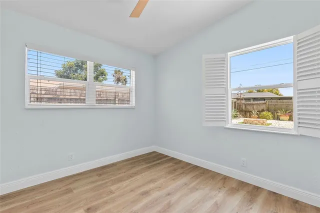 a view of balcony with two large windows