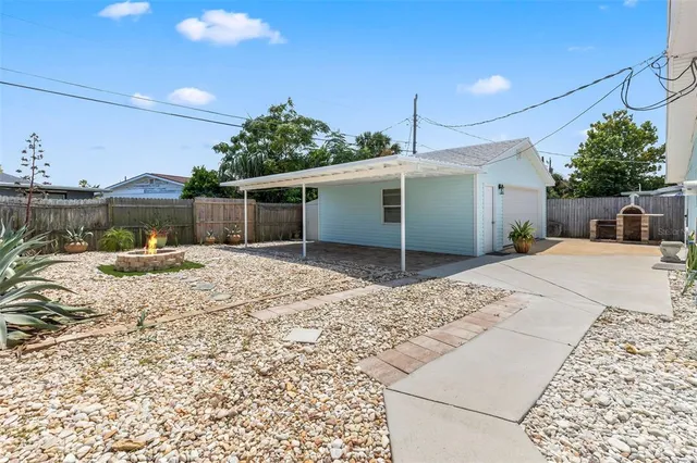 a living room with a baby crib furniture and a table