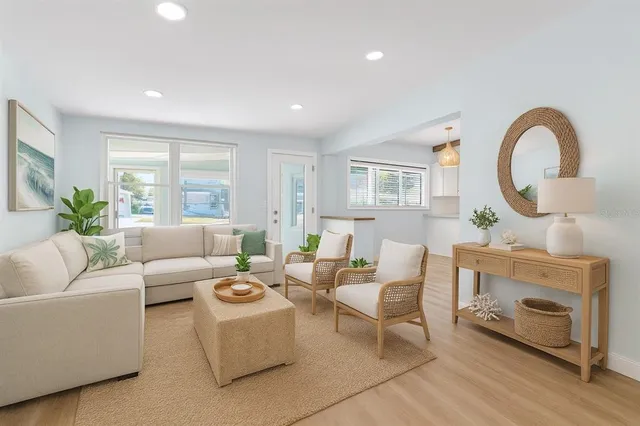 a view of a big room with wooden floor and windows