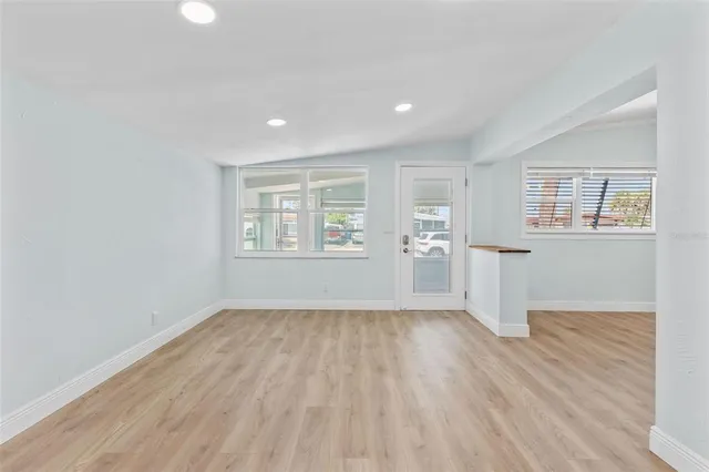 a view of kitchen with wooden floor and window