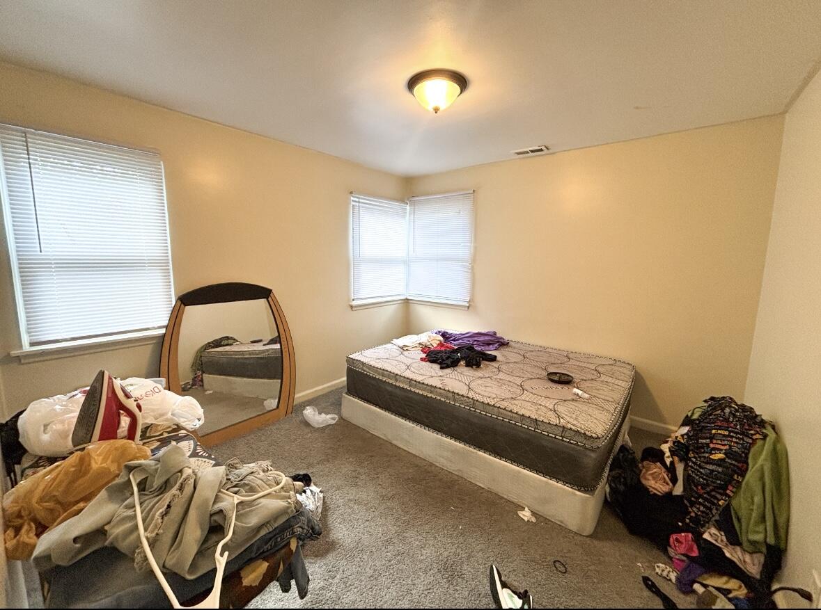 1163 Allen Street Gary, IN 46403 - Photo 11 of 13 a bedroom with bed and a window