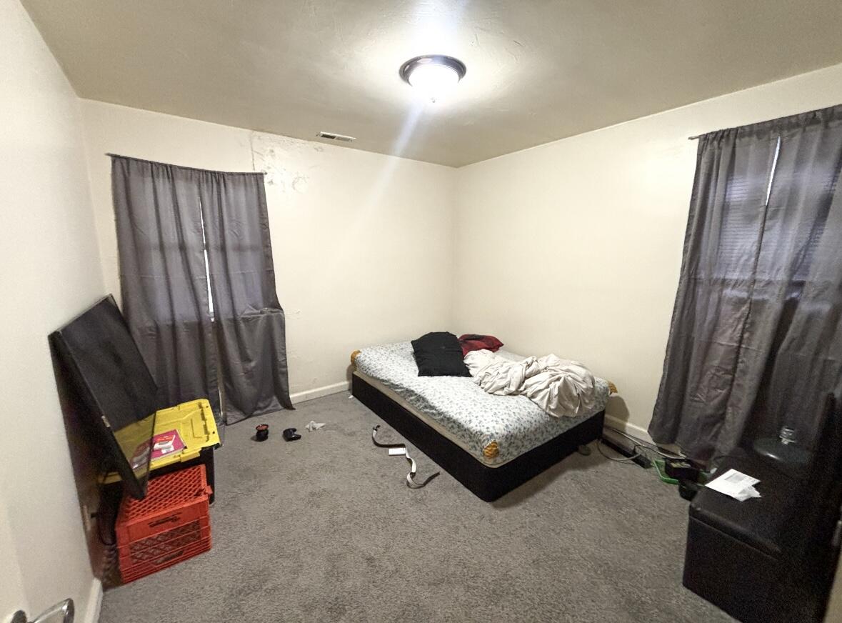 1163 Allen Street Gary, IN 46403 - Photo 12 of 13 a bedroom with bed and a window