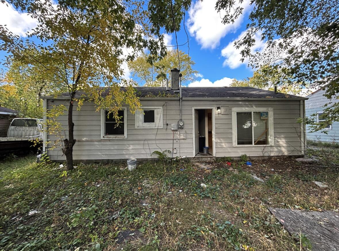 1163 Allen Street Gary, IN 46403 - Photo 3 of 13 a view of a house with a backyard