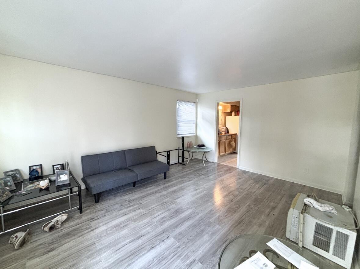 1163 Allen Street Gary, IN 46403 - Photo 7 of 13 a living room with furniture and a wooden floor