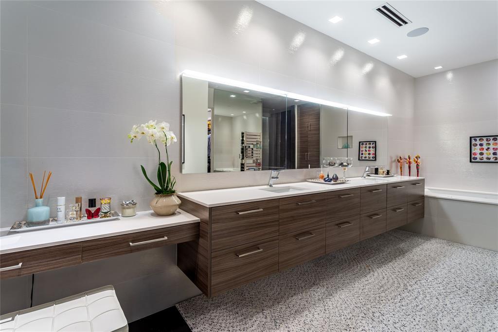 2300 Wolf Street, Unit 18A Dallas, TX 75201 - Photo 24 of 40 a bathroom with a double vanity sink and a mirror