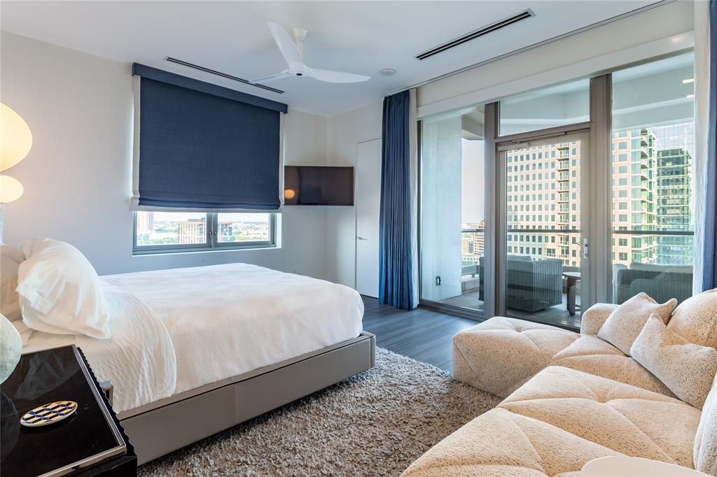 2300 Wolf Street, Unit 18A Dallas, TX 75201 - Photo 29 of 40 a bedroom with bed and glass window