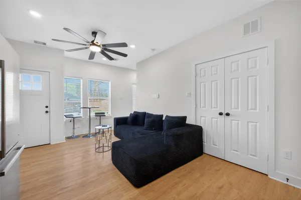 a living room with furniture and a window