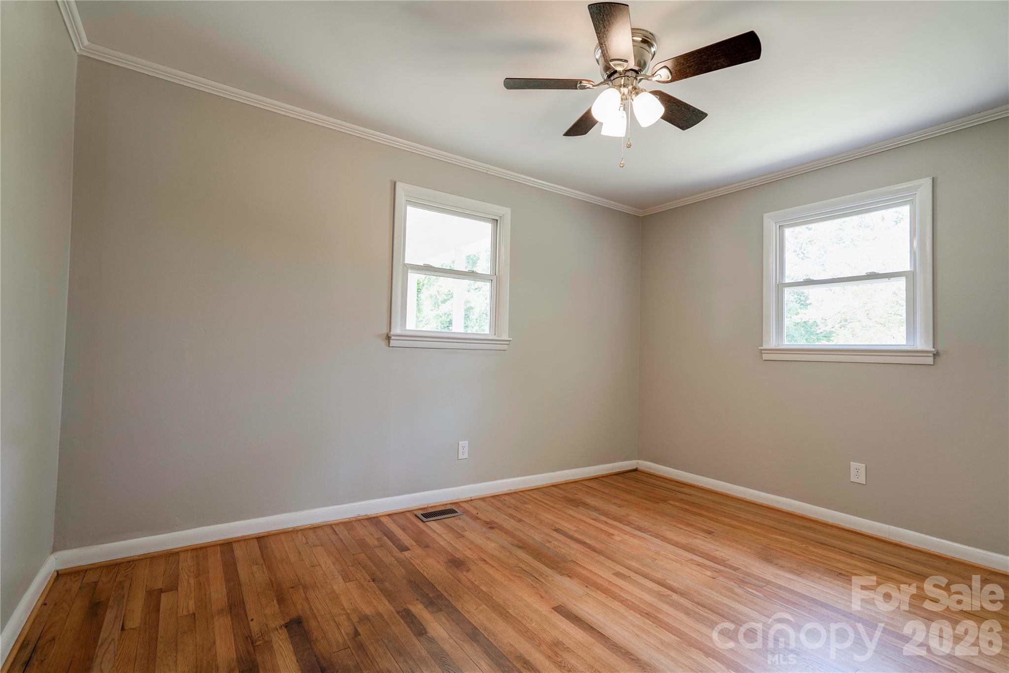 153 Greene Road Forest City, NC 28043 - Photo 14 of 23 a view of empty room with wooden floor and fan