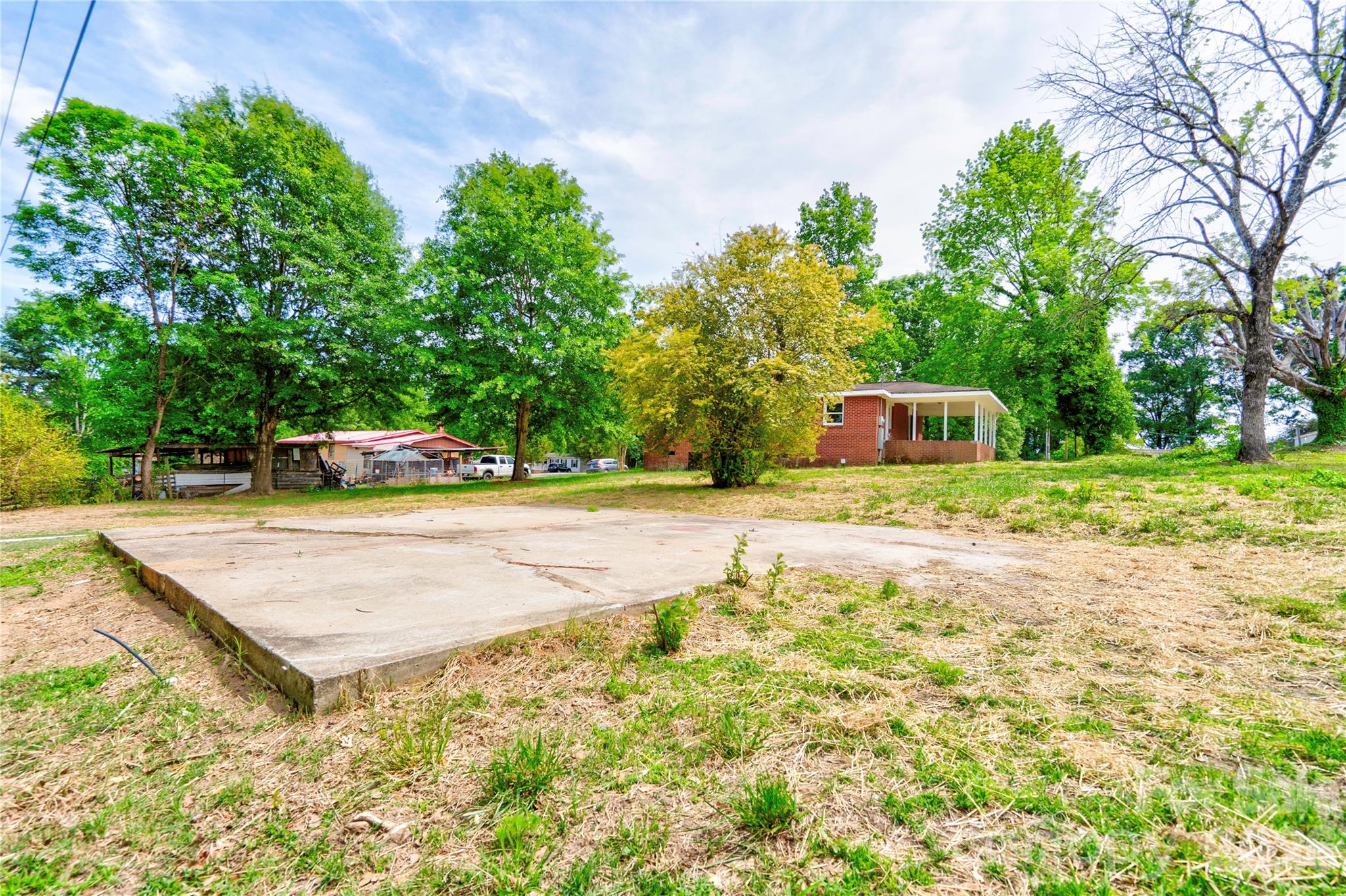 153 Greene Road Forest City, NC 28043 - Photo 4 of 23 a view of a backyard with trees