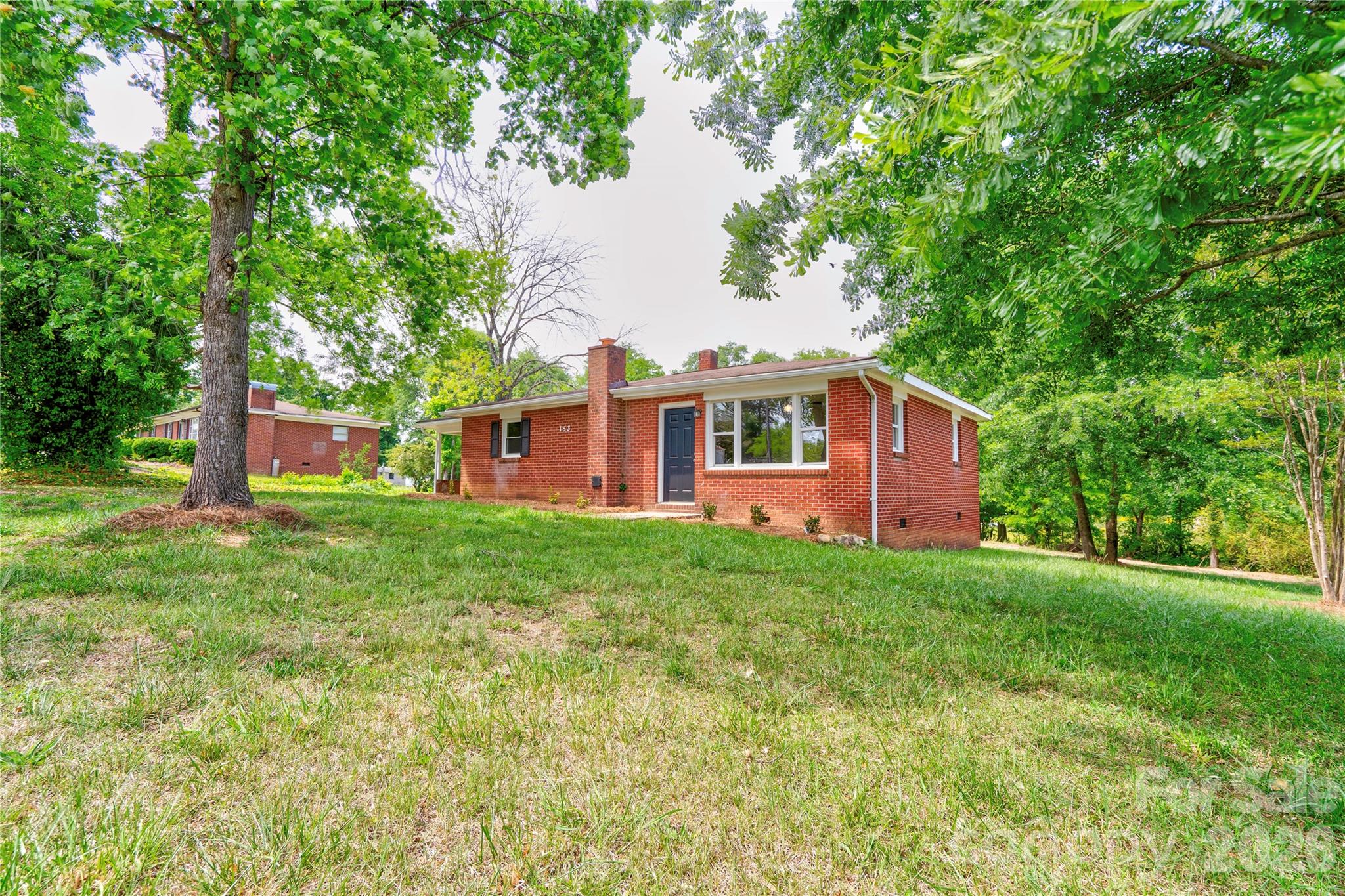 153 Greene Road Forest City, NC 28043 - Photo 6 of 23 a view of a house with backyard