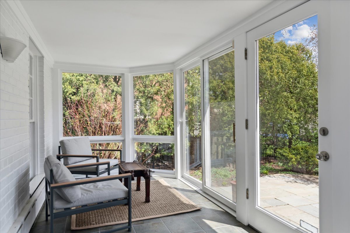 230 Oxford Road Kenilworth, IL 60043 - Photo 21 of 54 a view of a room with a furniture and floor to ceiling window