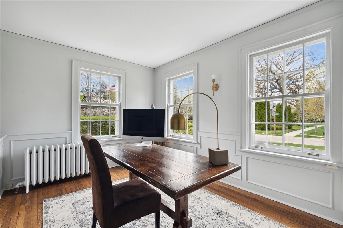 230 Oxford Road Kenilworth, IL 60043 - Photo 22 of 54 a view of a dining room with furniture window and wooden floor