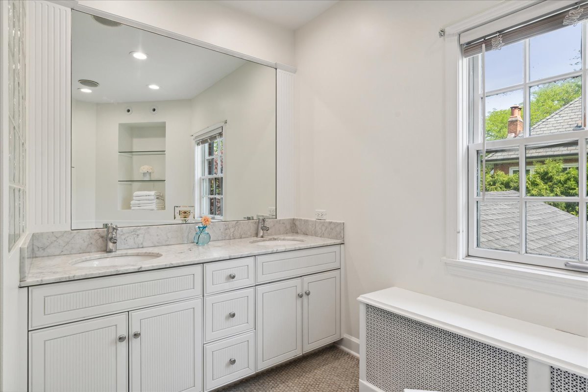 230 Oxford Road Kenilworth, IL 60043 - Photo 29 of 54 a bathroom with a granite countertop sink mirror and window