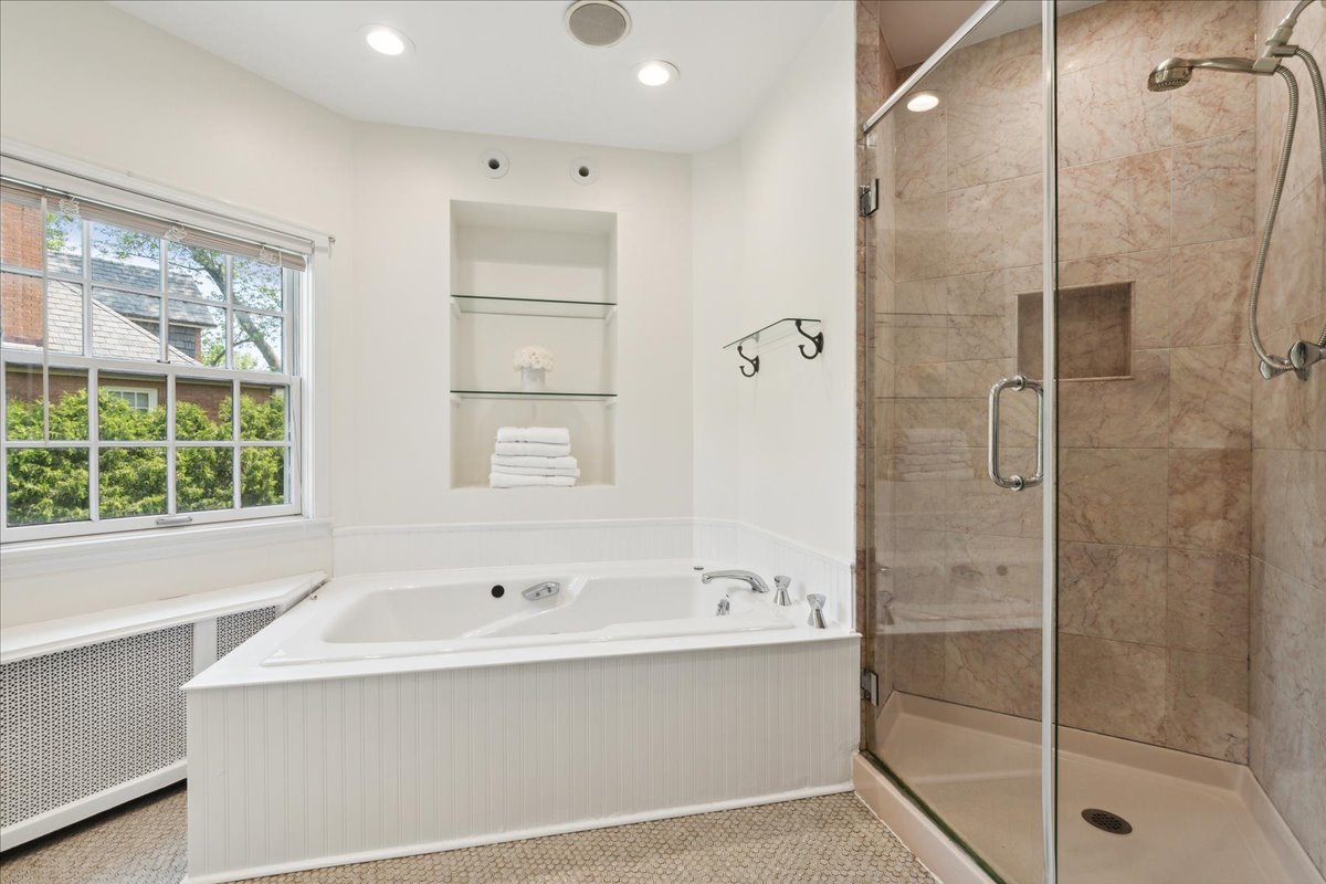 230 Oxford Road Kenilworth, IL 60043 - Photo 30 of 54 a bathroom with a bathtub and a shower