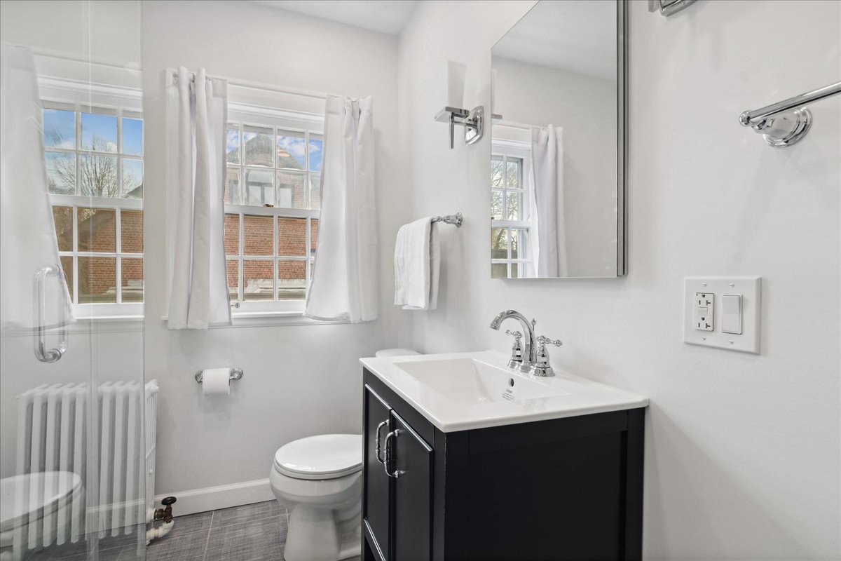 230 Oxford Road Kenilworth, IL 60043 - Photo 35 of 54 a bathroom with a sink toilet and a mirror