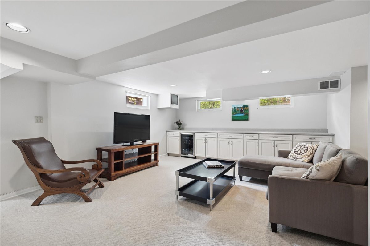 230 Oxford Road Kenilworth, IL 60043 - Photo 42 of 54 a living room with furniture and a flat screen tv