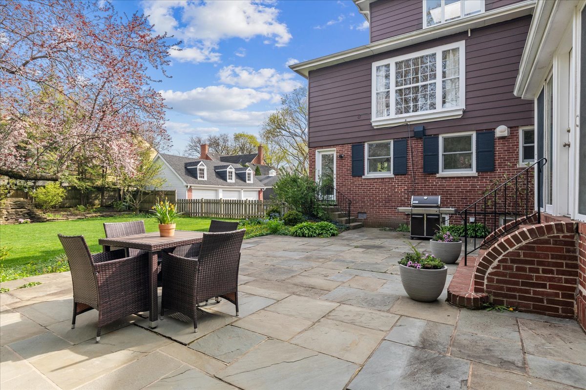 230 Oxford Road Kenilworth, IL 60043 - Photo 49 of 54 a view of a patio with table and chairs and potted plants